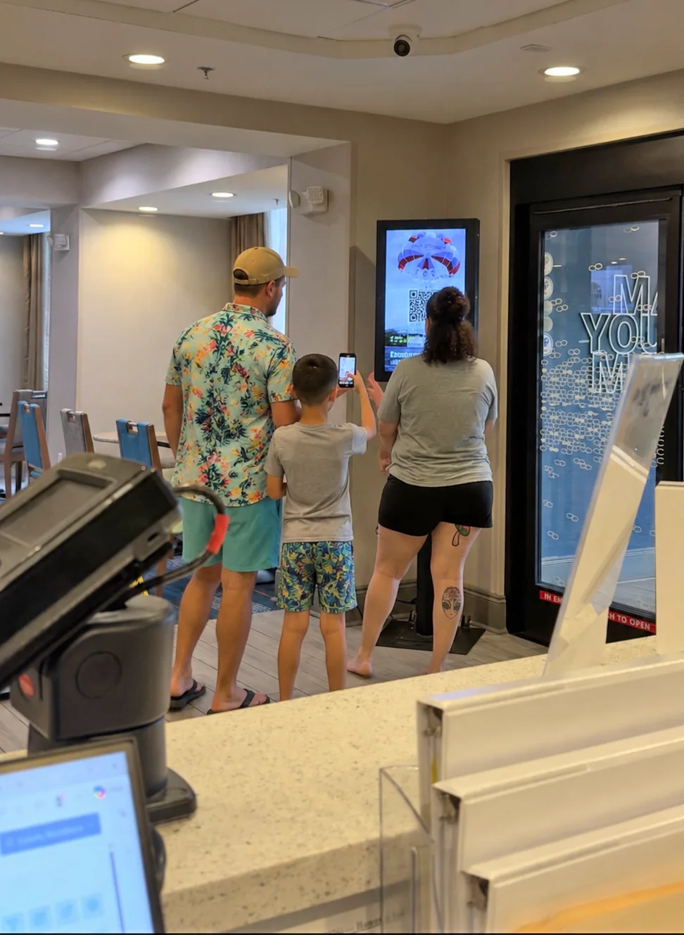 Crowd gathered in front of CDS digital displays at a Gulf Coast venue